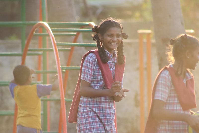 Children walking in to a centre in the morning